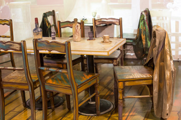 Wooden chair and table that is painted art. Empty painted wooden cafe table with chair