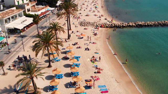 Aerial View Of Tourists & Umbrellas On Port Soller Beach, Mallorca.