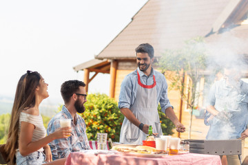 Friends having a barbecue party