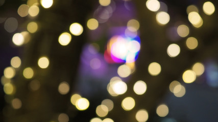 Bokeh images circle bubbles shape yellow color on black background.