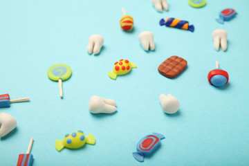 Teeth with sweet candies. Tooth caries in children's, dental healthcare.