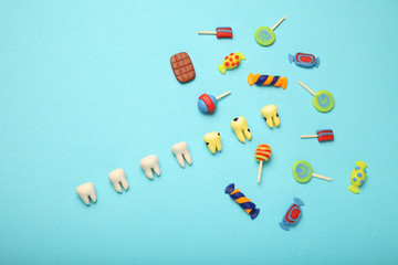 Teeth with sweet candies. Tooth caries in children's, dental healthcare.