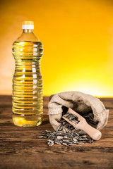 Sunflower oil in a bottle and sunflower seeds and sunflower
