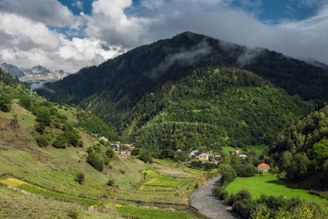 View to the Bogreshi village and small river in mountains of Svaneti Georgia