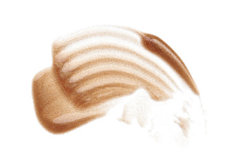 Smears and texture of gold lip gloss isolated on white background