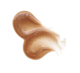 Smears and texture of gold lip gloss isolated on white background
