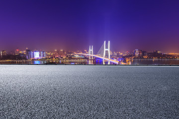 Empty road and Nanpu bridge at night in Shanghai,China