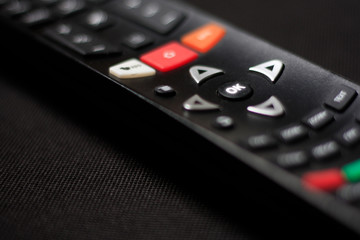 remote control tv on black background