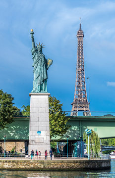 France, 15th arrondissement of Paris, Eiffel Tower and Statue of Libery at the pont de Grenelle over the Seine river