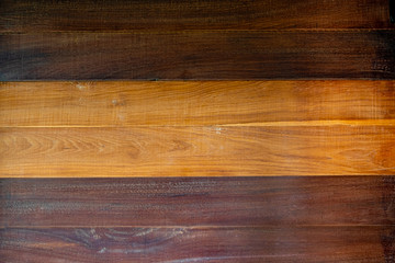 Brown wooden planks in the background.