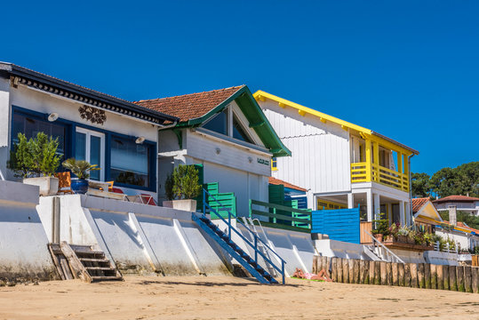 France, Gironde, Arcachon Bay, Cap-Ferret, L'Herbe village, houses along the beach and flood barriers.
