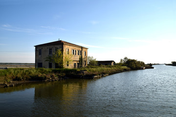 Obraz premium Lagoon houses at the mouth of the river Po - Italy