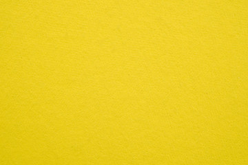 yellow color cardboard texture close-up for background and Wallpaper