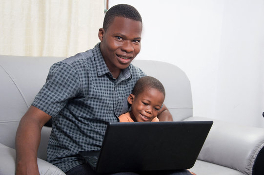 Happy family In front of a laptop.