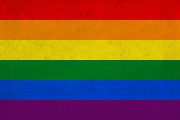 Vector high quality grunge style illustration of the rainbow gay and lesbian flag (LGBT movement) overlaid with grungy elements