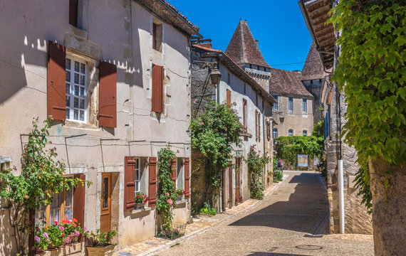 France, Dordogne, Perigord Vert, Saint-Jean-de-Cole (Plus Beau Village de France - Most Beautiful Village in France), peasant houses with flowers along the street