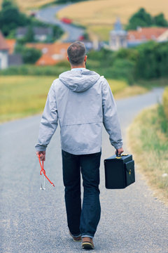 Medical deserts, a young doctor back on a country road, a village in the background