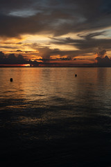 Beautiful dark colorful sky at sunset vivid colors over ocean to horizon in Sabah Borneo.