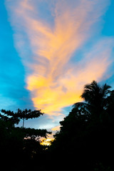Beautiful cloud formation and colors over silhouette 11