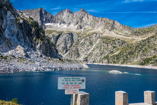 France, Hautes-Pyrenees, Haute-Vallee d'Aure, reservoir of the Cap de Long, Cr&ecirc;te des Laquettes and Pic des Trois Conseillers, signs for fishing restriction