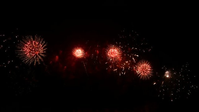 4K footage seamless loop of real colorful fireworks festival in the sky display at night during national holiday, new year party or celebration event