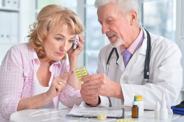 Close up portrait of senior doctor with elderly patient