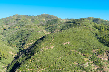 The highest elevation on the canary island La Gomera, the rock formation Alto de Garajonay. The summit, located in the Garajonay National Park, named after a legend, is 1487 m high