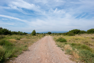 Rural road between mountains of the Sierra de Gudar, Valbona