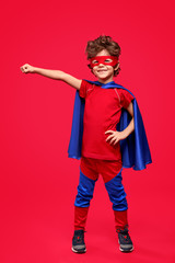 Cheerful superhero in heroic pose