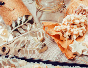 a lot of sea theme in mess like shells, candles, perfume, girl stuff on linen, pretty textured post card view vintage close up