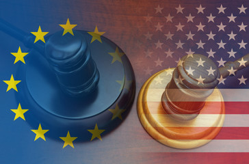 Unites States and European Union economy conflict and legal problems concept. Gavels with flags on...