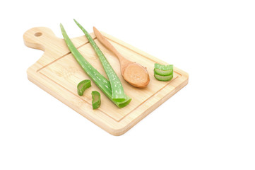 Aloe vera gel on wooden spoon and aloe vera slice on wooden plate isolated on white background, Top view fresh aloe vera with copy space