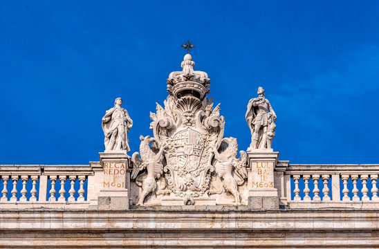 Spain, Madrid, facade of the Royal Palace (1738) in front of the Plaza de Oriente, sculpted coat of arms