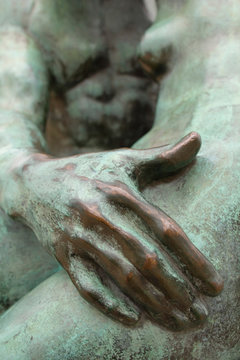 France, Paris, 75, 1st arrondissement, Tuileries Garden, close-up showing the hand of the man, detailed view of "le Baiser" by Auguste Rodin (made of bronze)