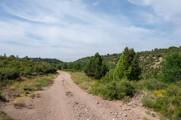 Rural road between mountains of the Sierra de Gudar, Valbona