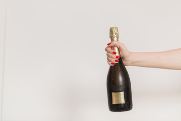 Party and holiday celebration concept. Champagne bottle on blue background.
