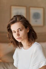 Young attractive woman in t shirt and with brown hair