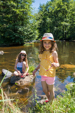 Auvergne - Rhone-Alpes - Haute-Loire - Saint-Julien-d'Ance - Girls playing on the bank of the Ance river.