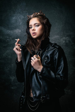 Young woman wearing a wreath, smoking a cigarette, a drink in her hand