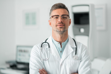 Professional plastic surgeon wearing stethoscope on neck