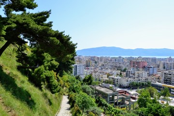 Albania, Vlore/ Vlora, cityscape seen from Kuzum Baba hill. Aerial city view, city panorama of Vlore. Path leading to Kuzum Baba hill 