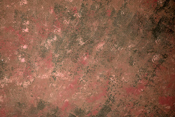 Dark red wall, textured brown background with copy space