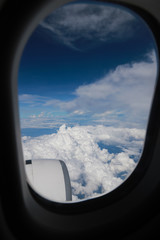 The blue sky and cloud on the airplane from window