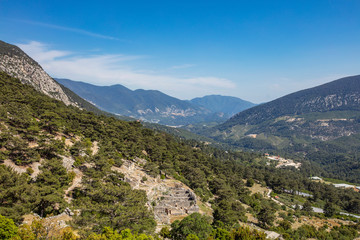 Obraz premium Ancient Lycian City of Arykanda. Overview of the gymnasium complex. Arykanda is an ancient city built on mountain terraces at an altitude of 1000 meter. It is an amazing ancient city. Antalya-Turkey