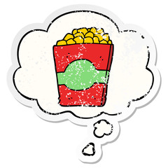 cartoon popcorn and thought bubble as a distressed worn sticker