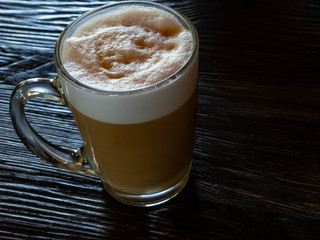 coffee latte on black wood table near window, Coffee break