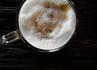 coffee latte on black wood table near window, Coffee break