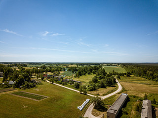 countryside roads and fields with small village. aerial view