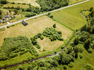 countryside roads and fields with small village. aerial view