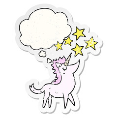cartoon unicorn and thought bubble as a distressed worn sticker